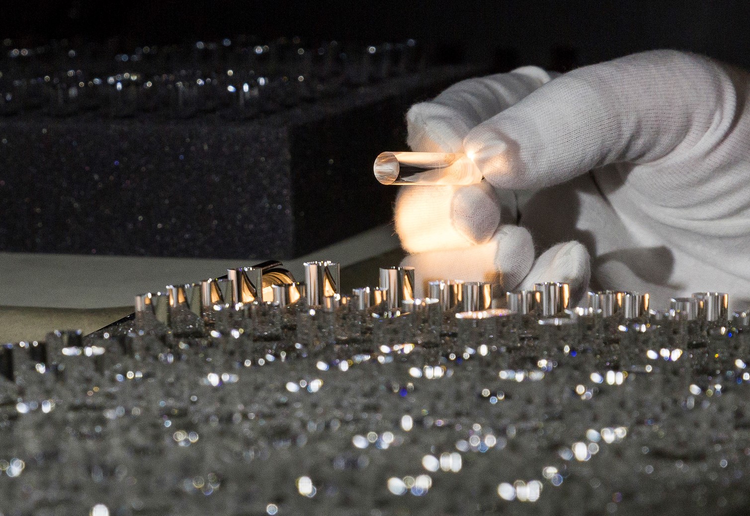 Commercial Optics Hand holding an optical product