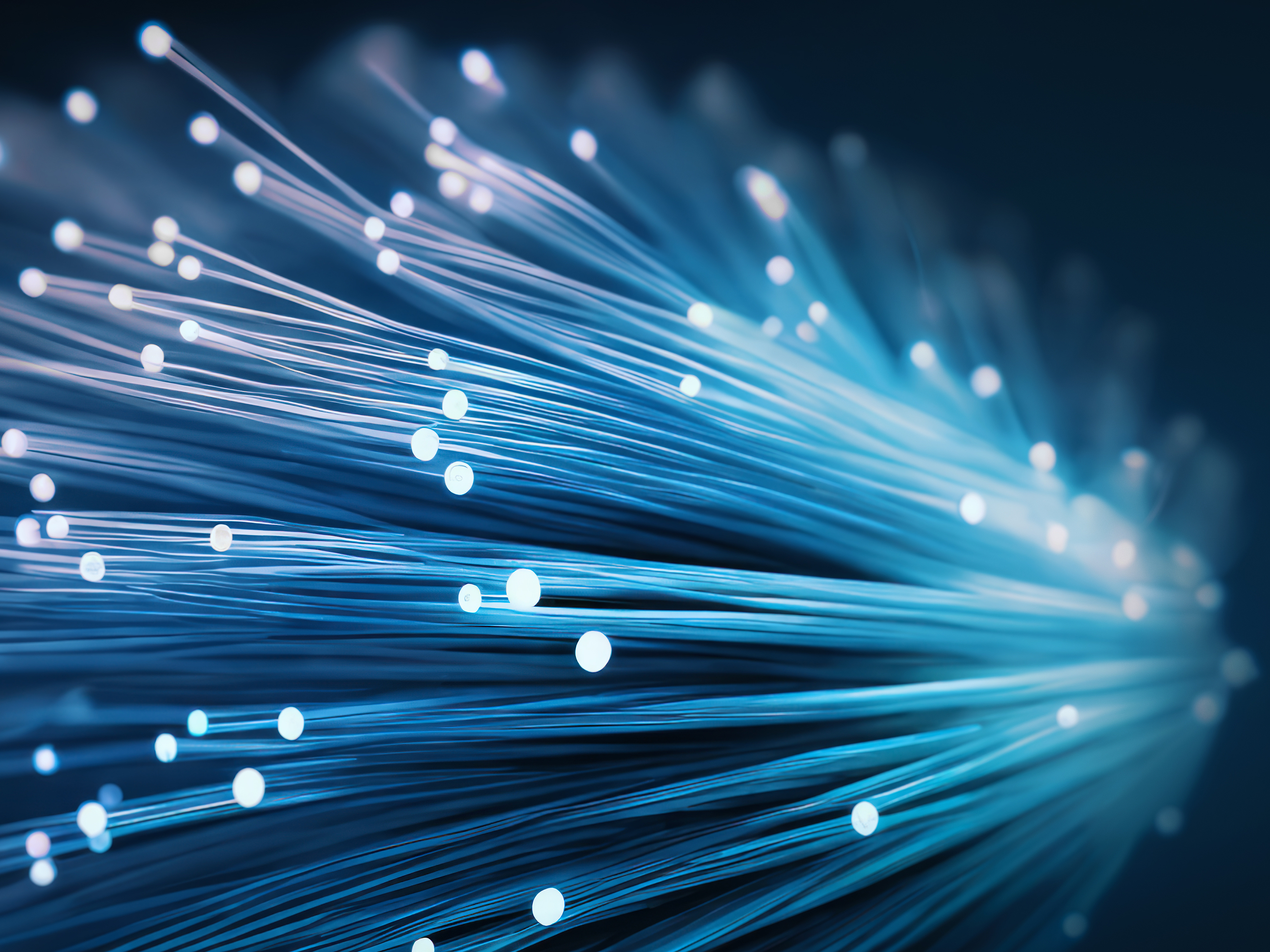AI generated. A fiber optic bundle, with blue lighting effect onblack background